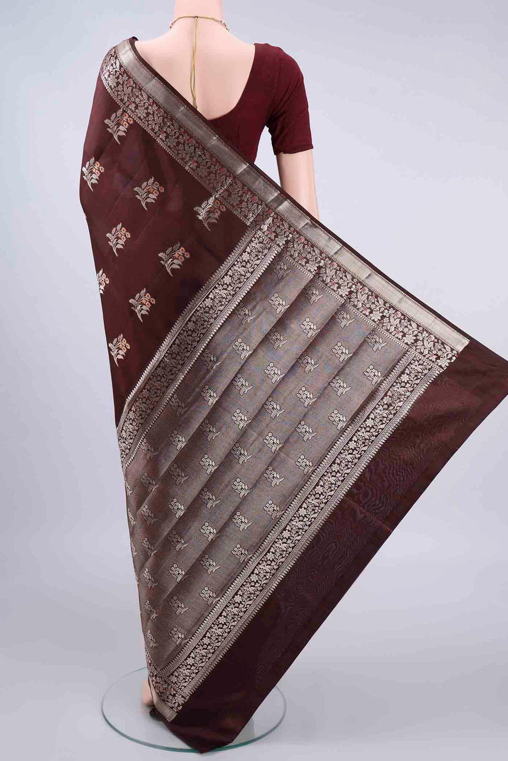 Flat view of Pure Silk Brown Banarasi Raw Saree with Zari And Thread Butta on the body and Zari Border. 