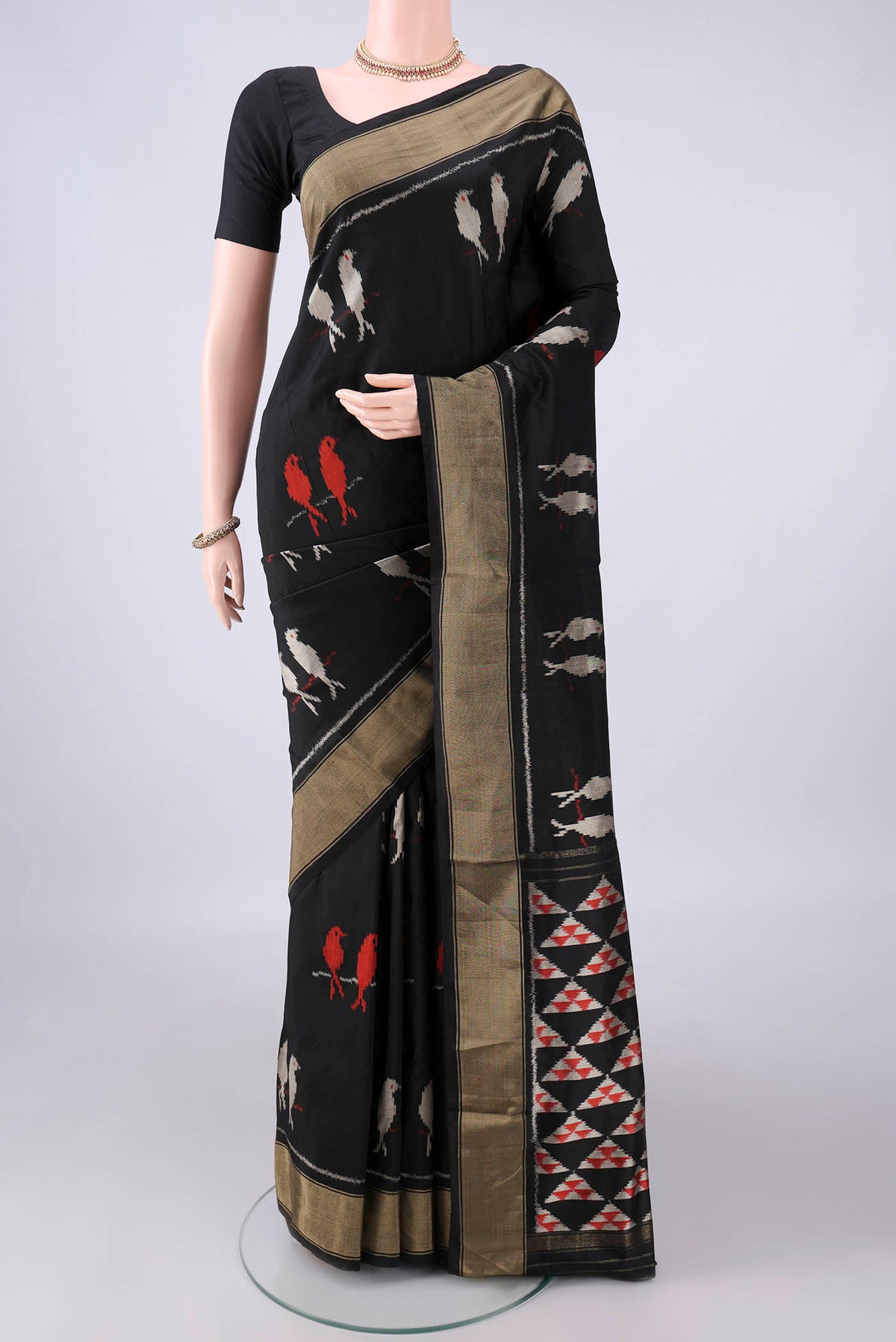 Pure Silk Black Pochampally Saree with Ikat design on the body and Zari Border.  displayed on a mannequin