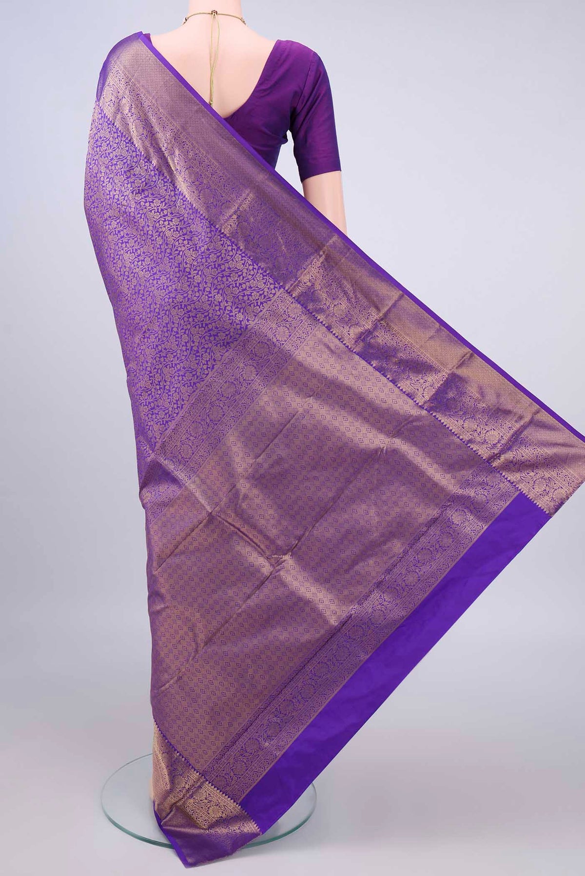 Flat view of Pure Silk Purple Kanjivaram Saree with Zari Brocade on the body and Zari Border. 