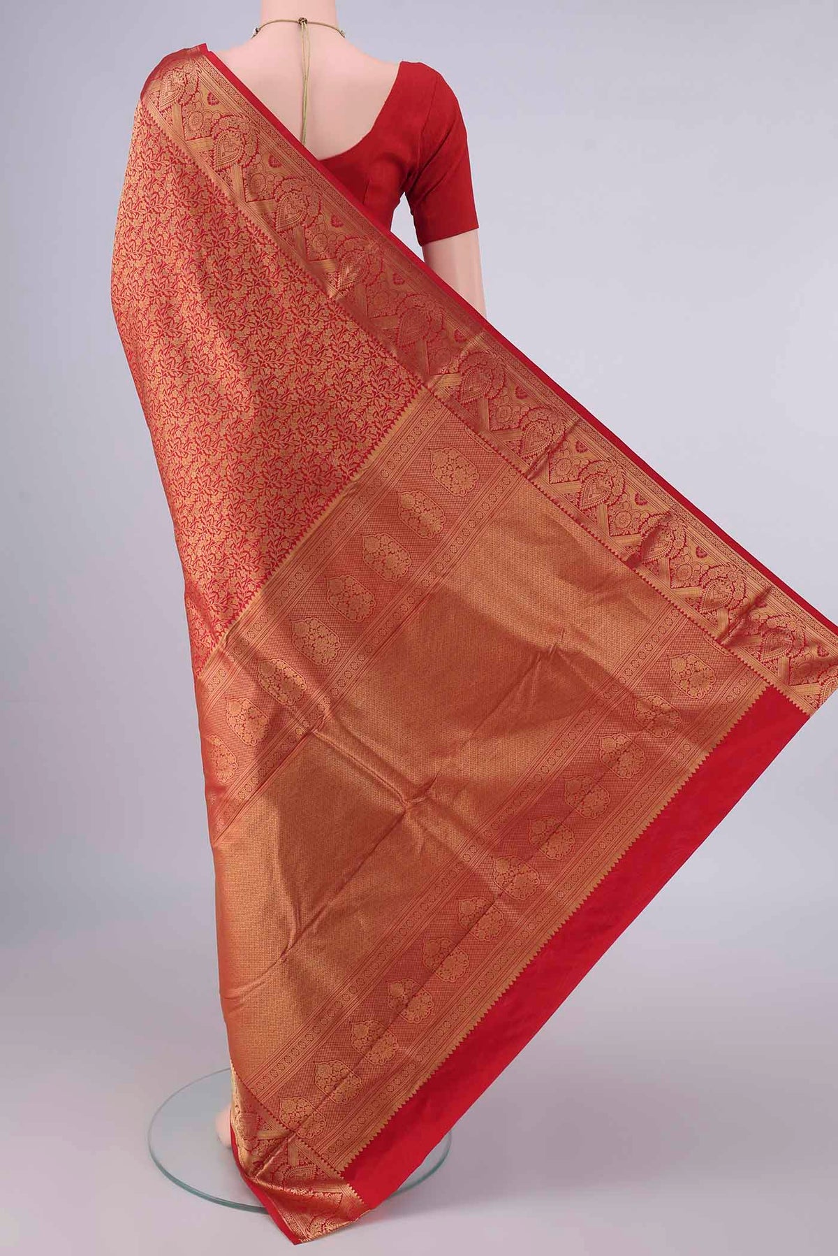 Flat view of Pure Silk Red Kanjivaram Saree with Zari Brocade on the body and Zari Border. 