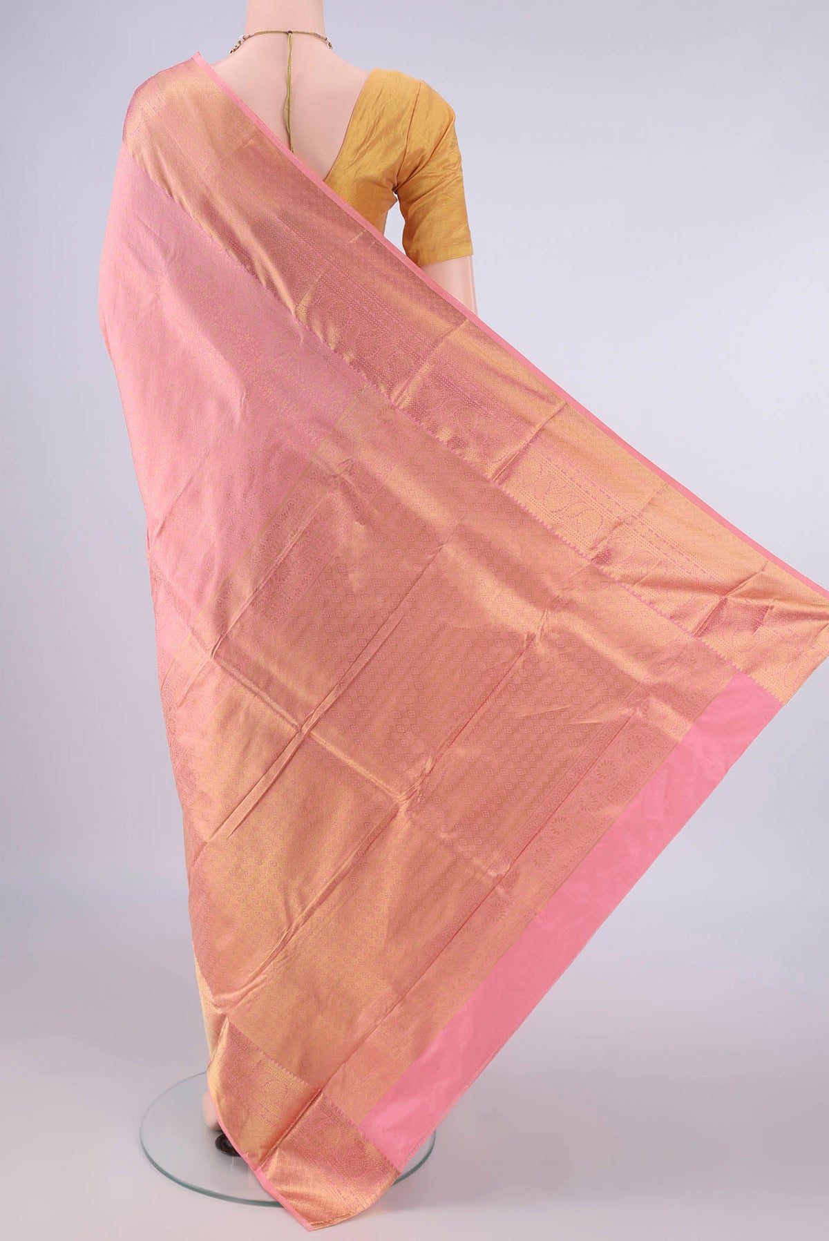 Flat view of Pure Silk Peach Kanjivaram Saree with Zari Brocade on the body and Zari Border. 