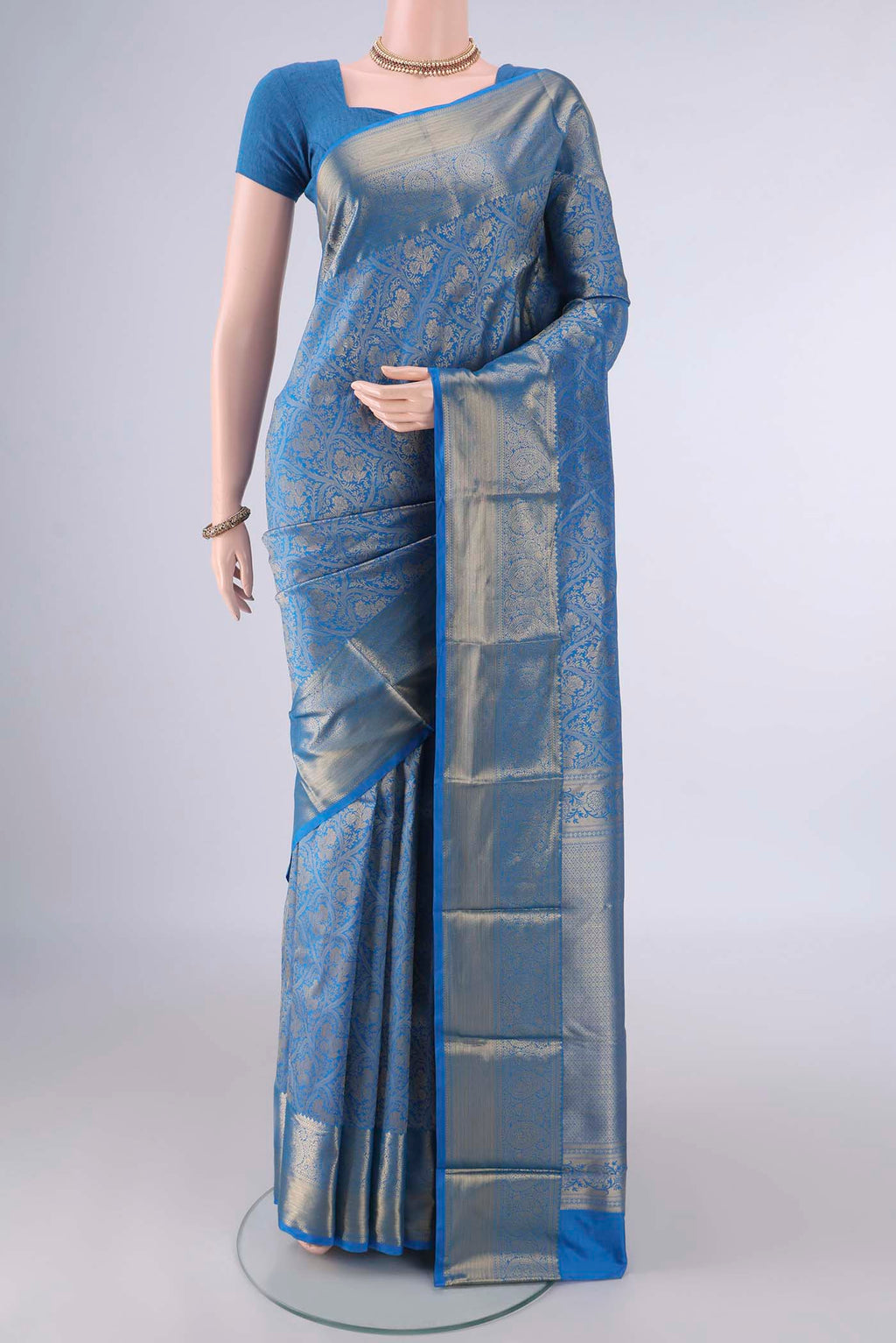 Pure Silk Blue Kanjivaram Saree with Zari Brocade on the body and Zari Border.  displayed on a mannequin