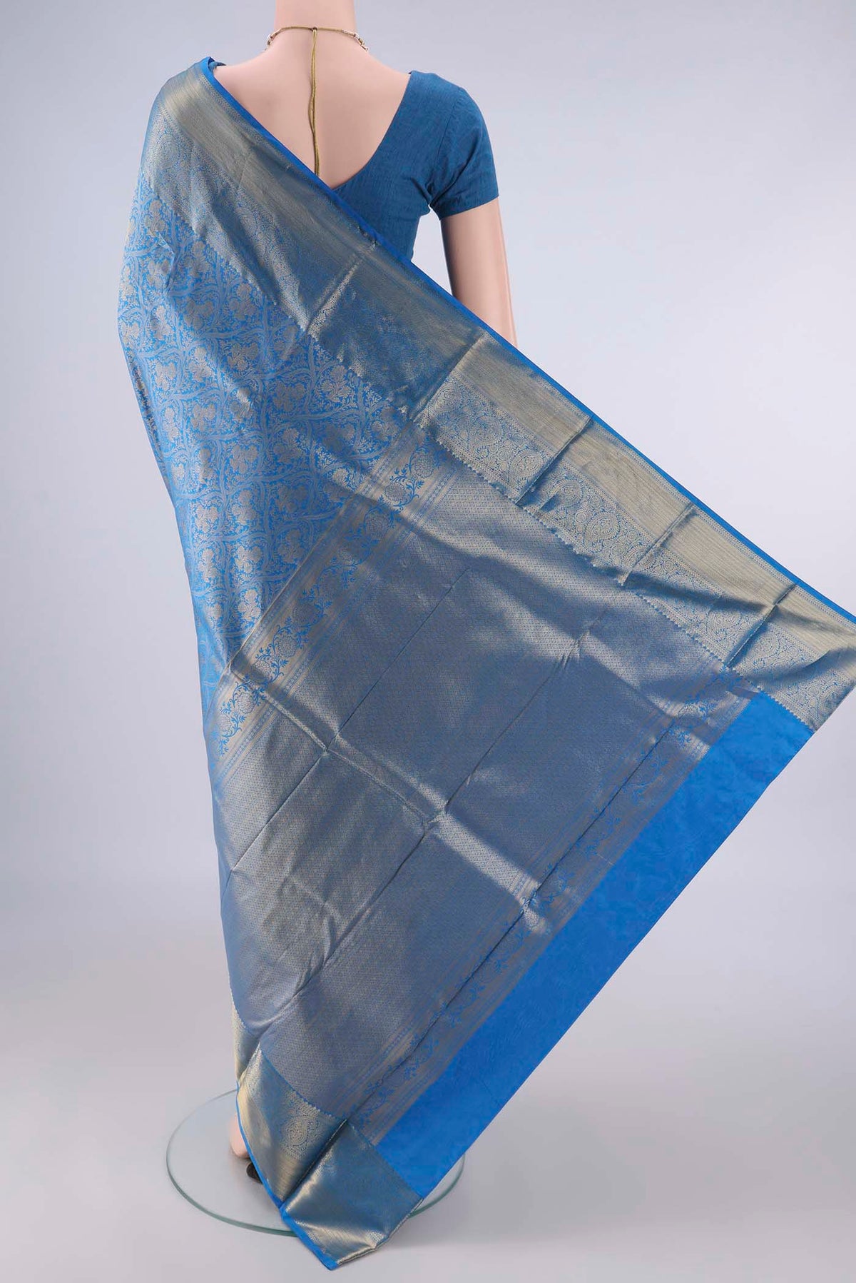 Flat view of Pure Silk Blue Kanjivaram Saree with Zari Brocade on the body and Zari Border. 