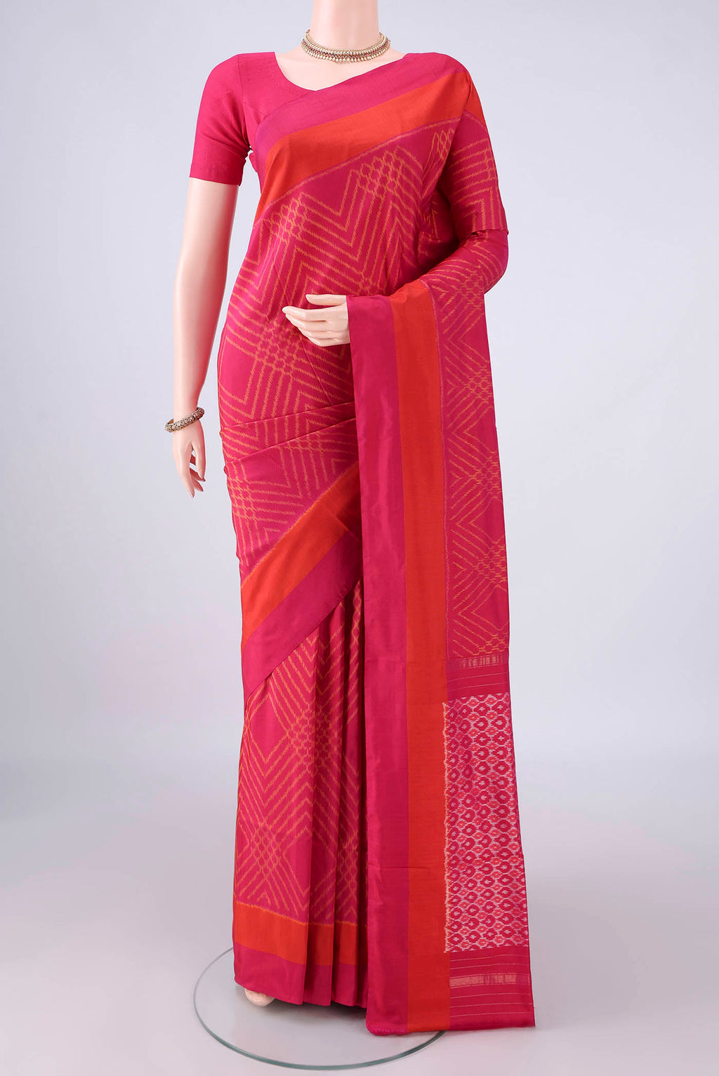 Pure Silk Rani Pink Pochampally Saree with Pure Ikat on the body and Plain Border.  displayed on a mannequin