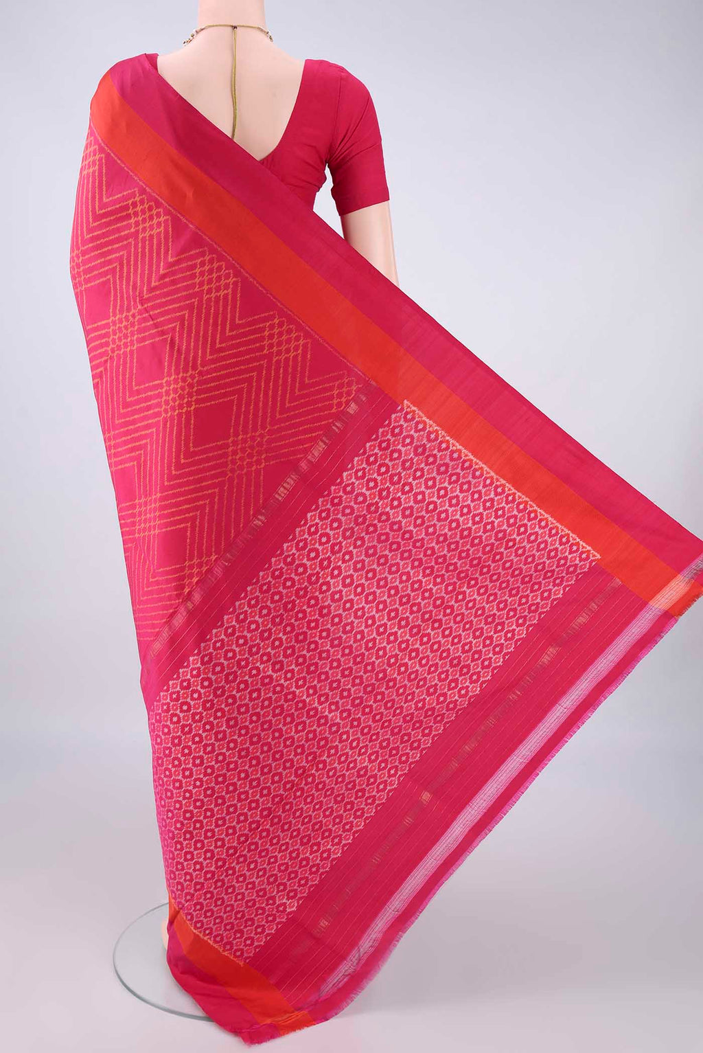 Flat view of Pure Silk Rani Pink Pochampally Saree with Pure Ikat on the body and Plain Border. 