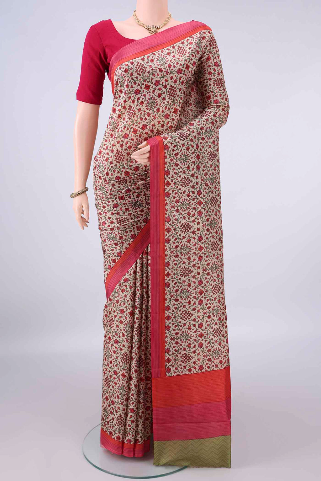 Pure Silk Beige Printed Saree with Printed design on the body and Plain Border.  displayed on a mannequin