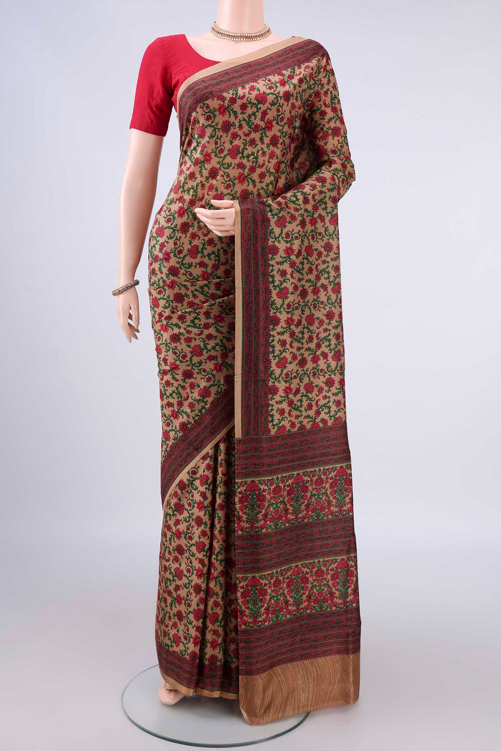 Pure Silk Dark Beige Printed Saree with Printed design on the body and Printed Border.  displayed on a mannequin