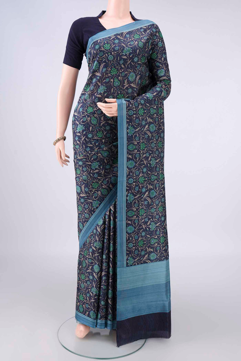 Pure Silk Navy Blue Printed Saree with Printed design on the body and Plain Border.  displayed on a mannequin