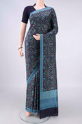 Pure Silk Navy Blue Printed Saree with Printed design on the body and Plain Border.  displayed on a mannequin
