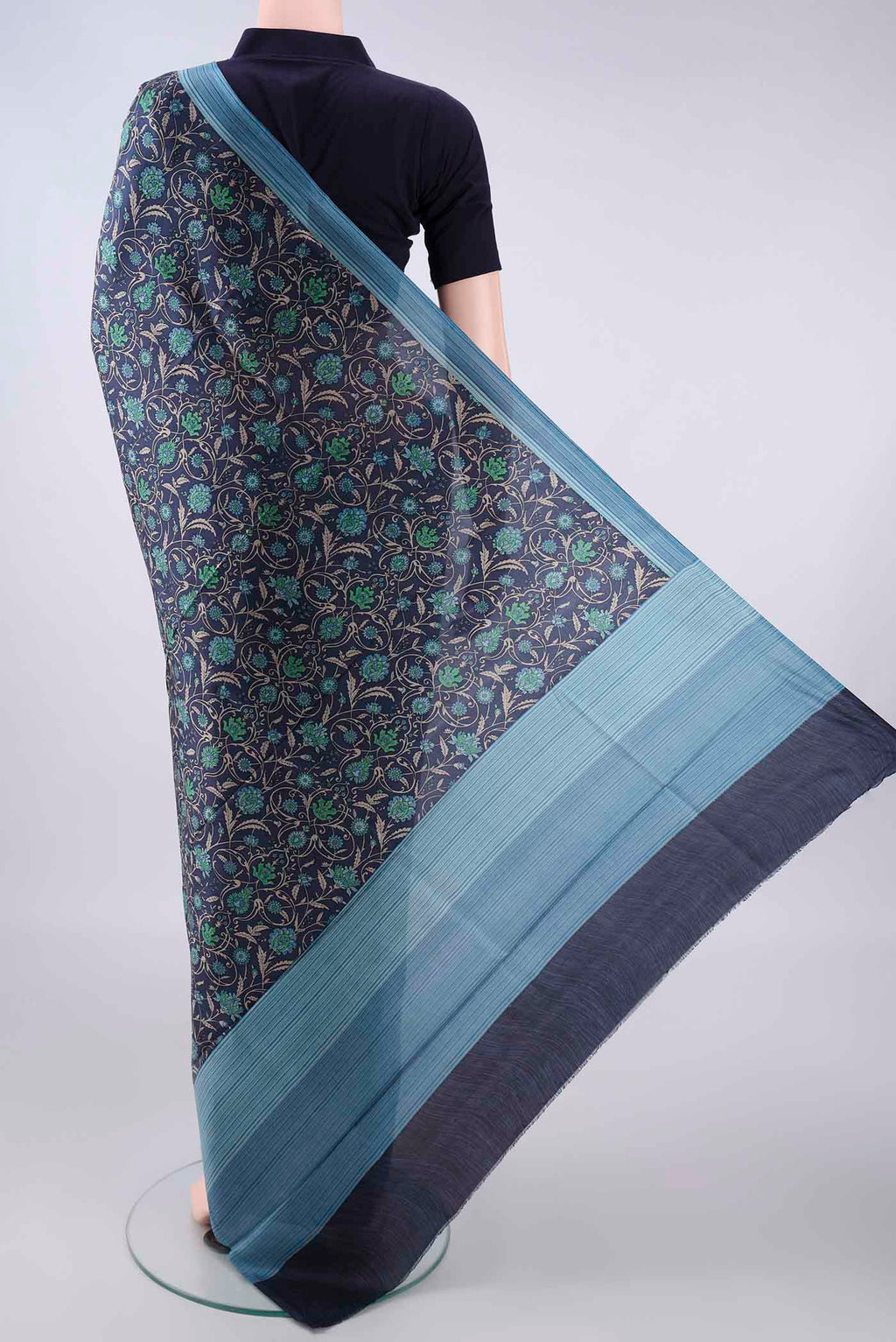 Flat view of Pure Silk Navy Blue Printed Saree with Printed design on the body and Plain Border. 