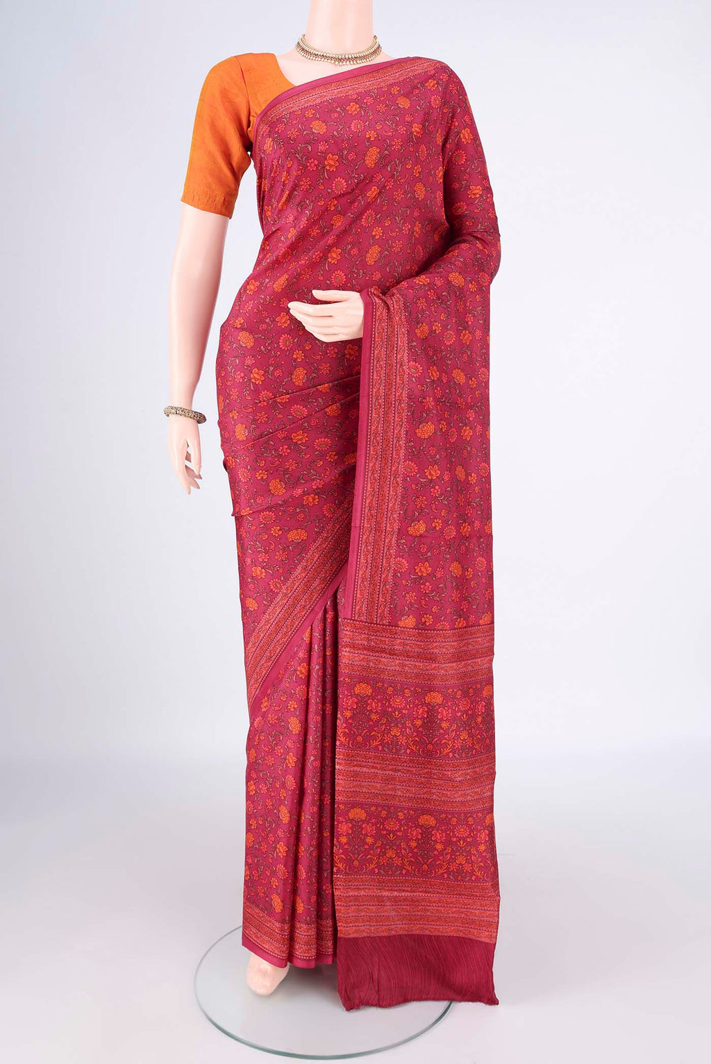 Pure Silk Coral Printed Saree with Printed design on the body and Plain Border.  displayed on a mannequin