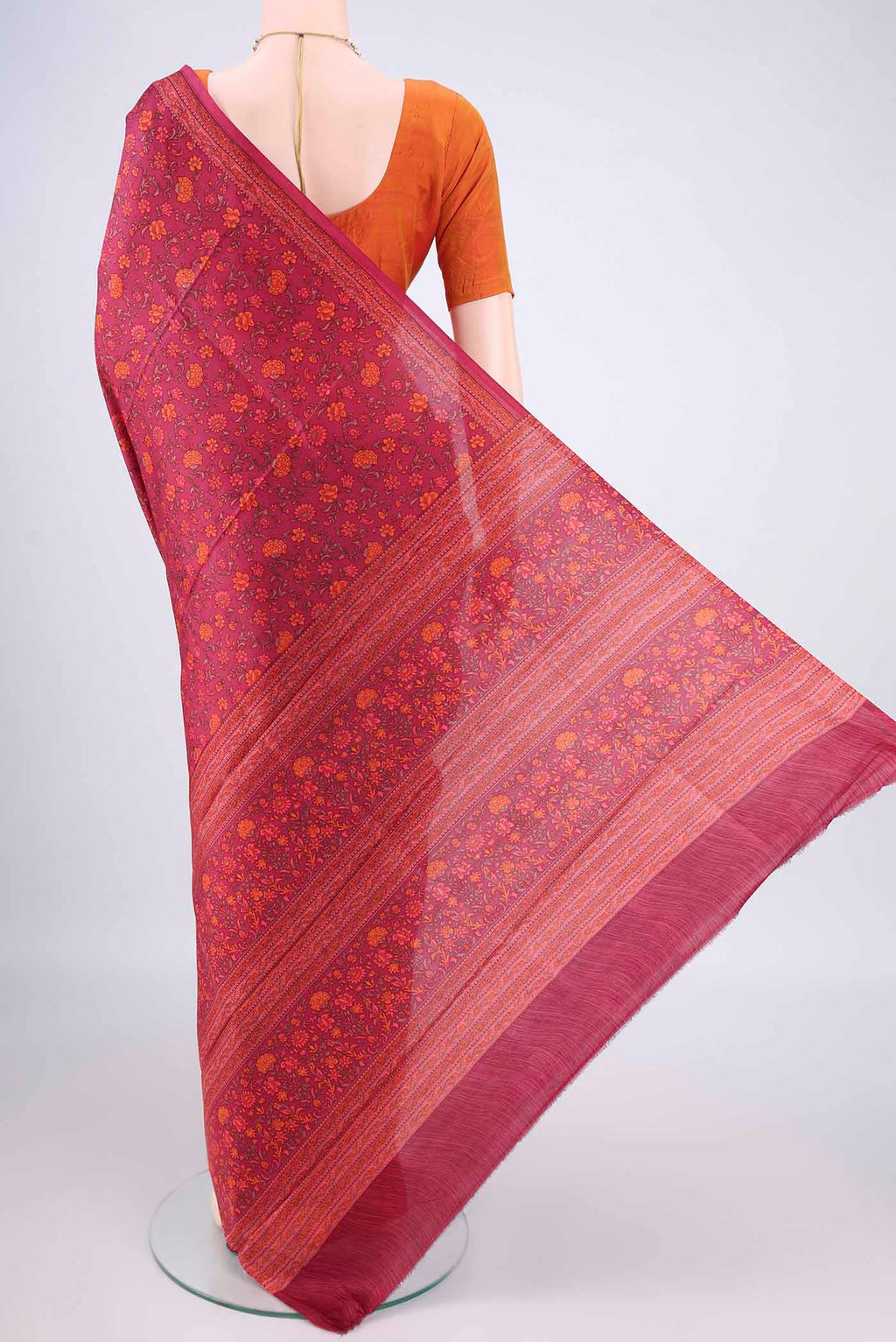 Flat view of Pure Silk Coral Printed Saree with Printed design on the body and Plain Border. 