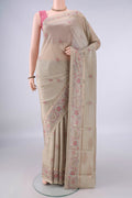 Pure Silk Beige Printed Saree with Printed design on the body and Zari Border.  displayed on a mannequin