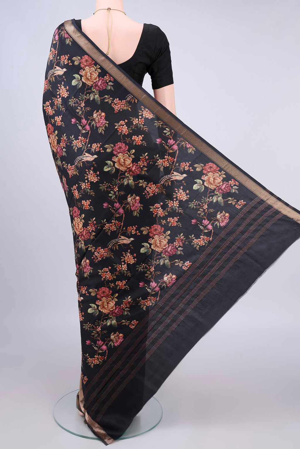 Flat view of Pure Silk Black Printed Saree with Printed design on the body and Zari Border. 