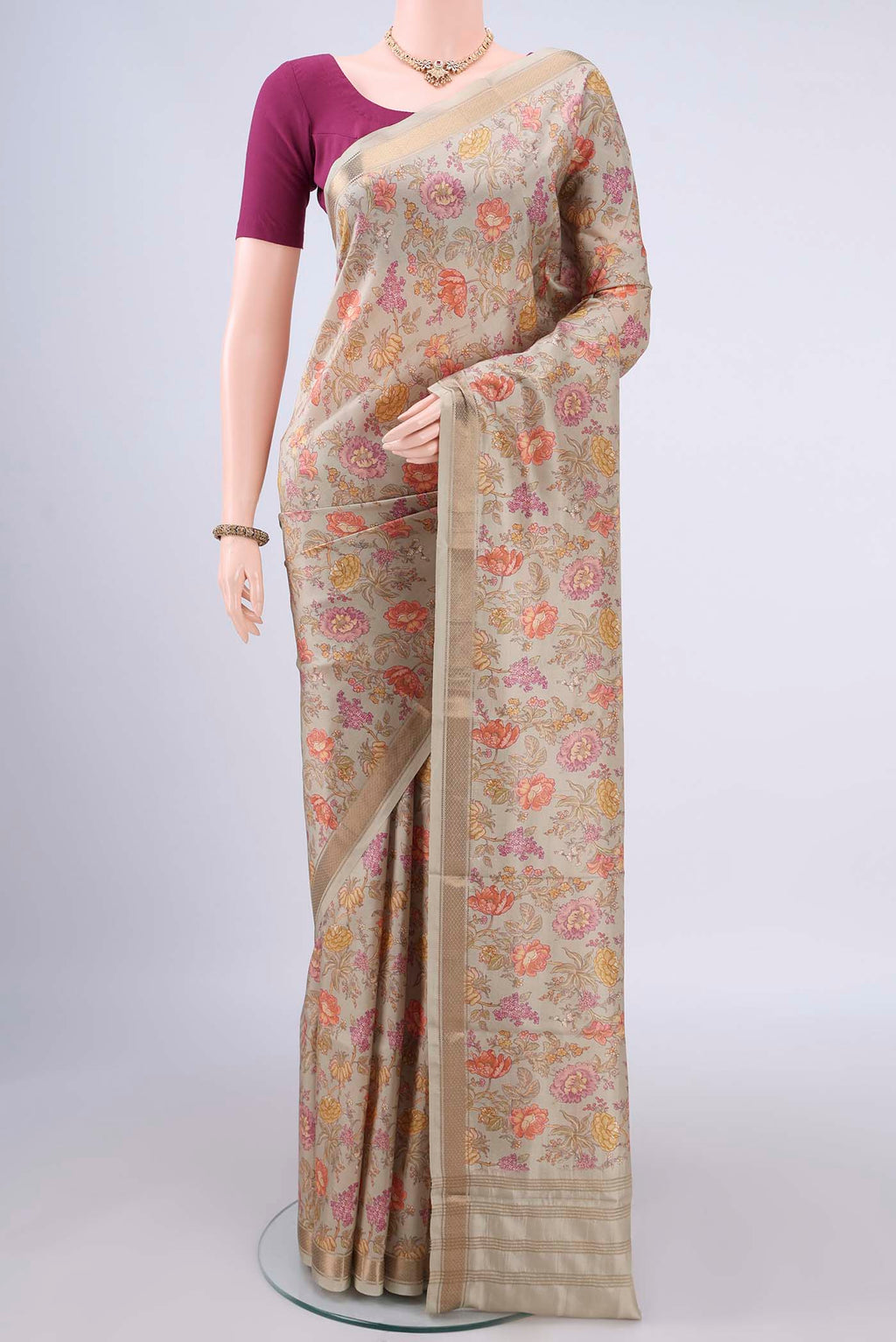 Pure Silk Beige Printed Saree with Printed design on the body and Zari Border.  displayed on a mannequin