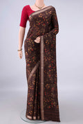 Pure Silk Brown Printed Saree with Printed design on the body and Zari Border.  displayed on a mannequin
