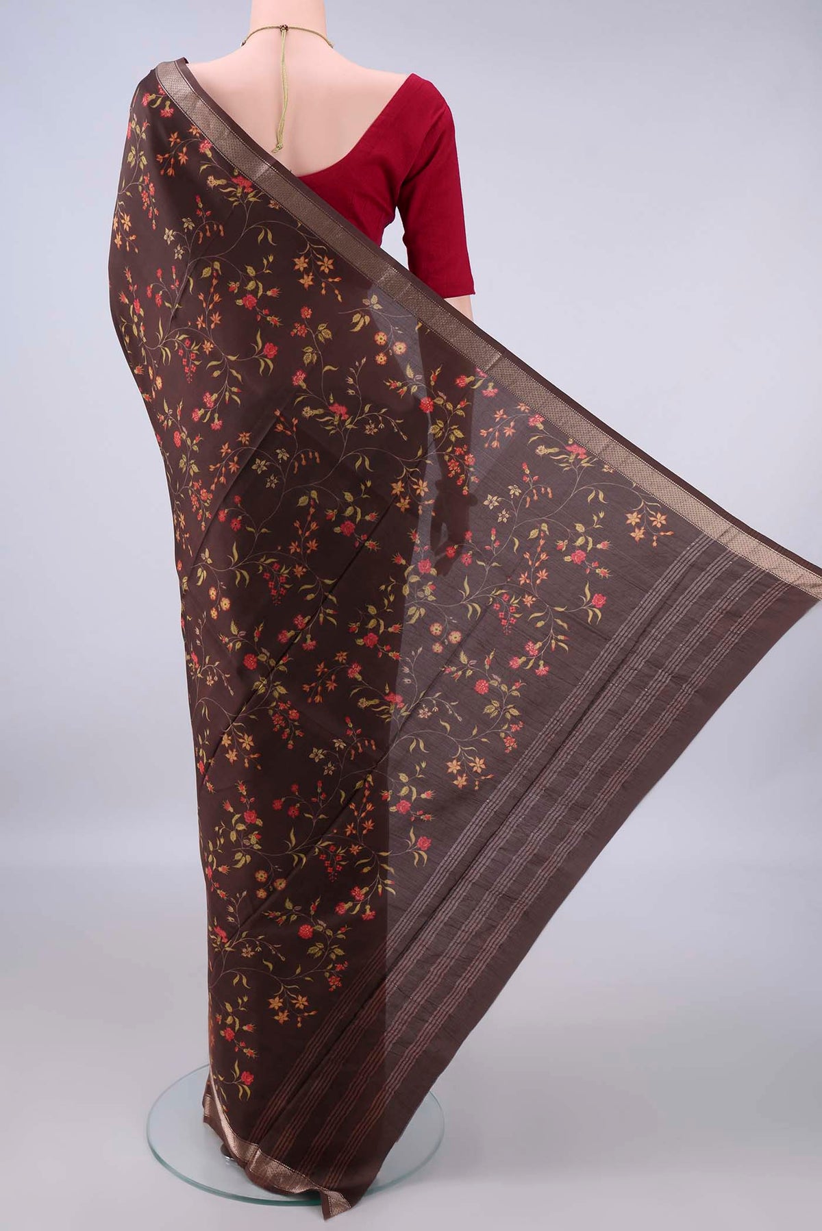 Flat view of Pure Silk Brown Printed Saree with Printed design on the body and Zari Border. 