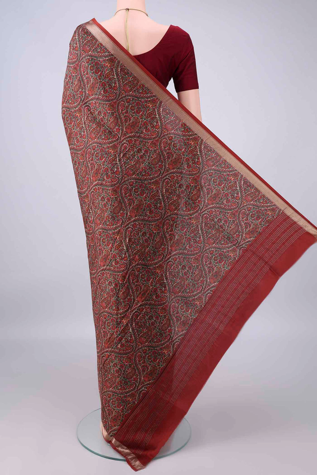 Flat view of Pure Silk Rust Printed Saree with Printed design on the body and Zari Border. 