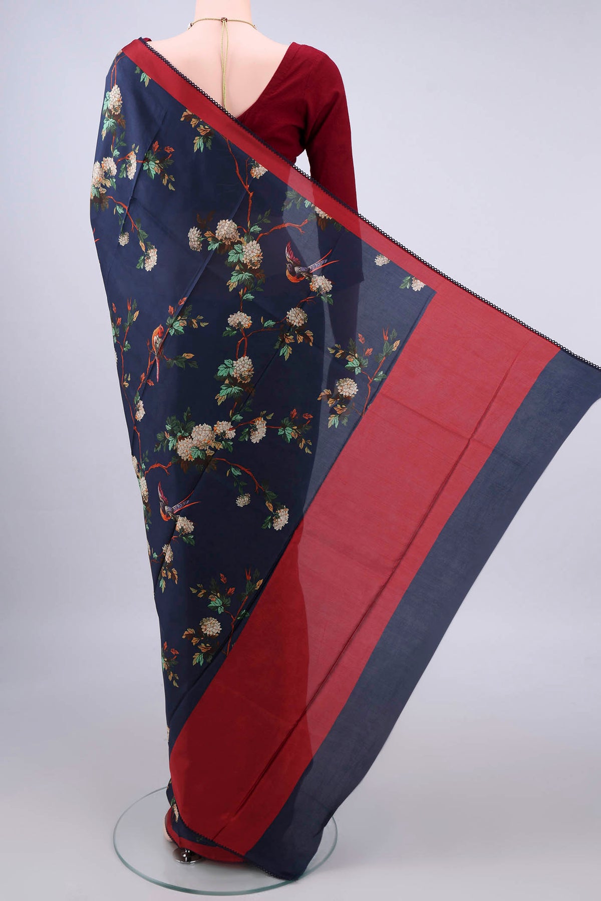 Flat view of Pure Silk Navy Blue Printed Saree with Printed design on the body and Thread Border. 