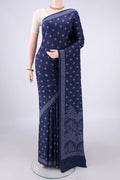 Pure Silk Navy Blue Printed Saree with Printed design on the body and Plain Border.  displayed on a mannequin