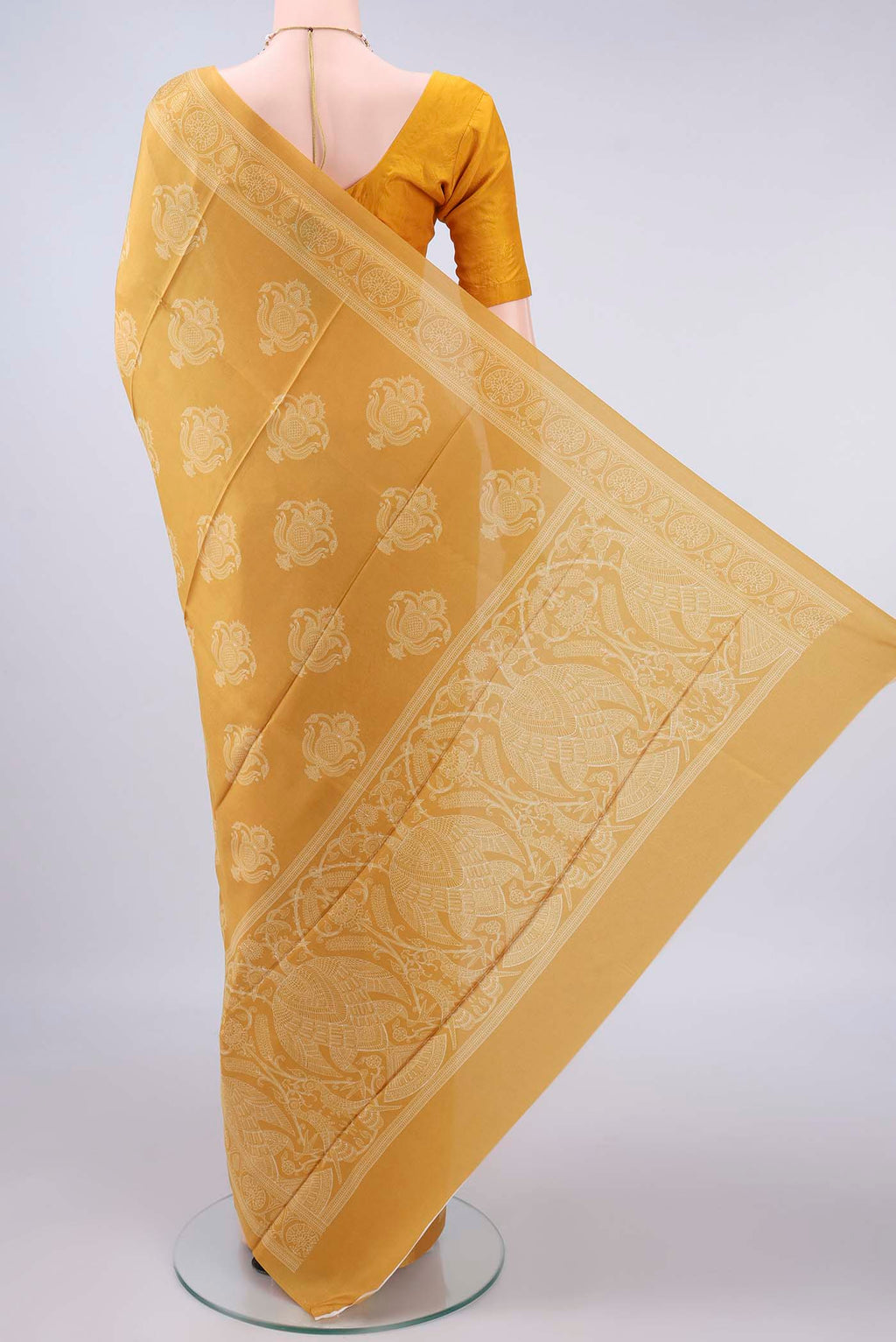 Flat view of Pure Silk Mustard Printed Saree with Printed design on the body and Printed Border. 