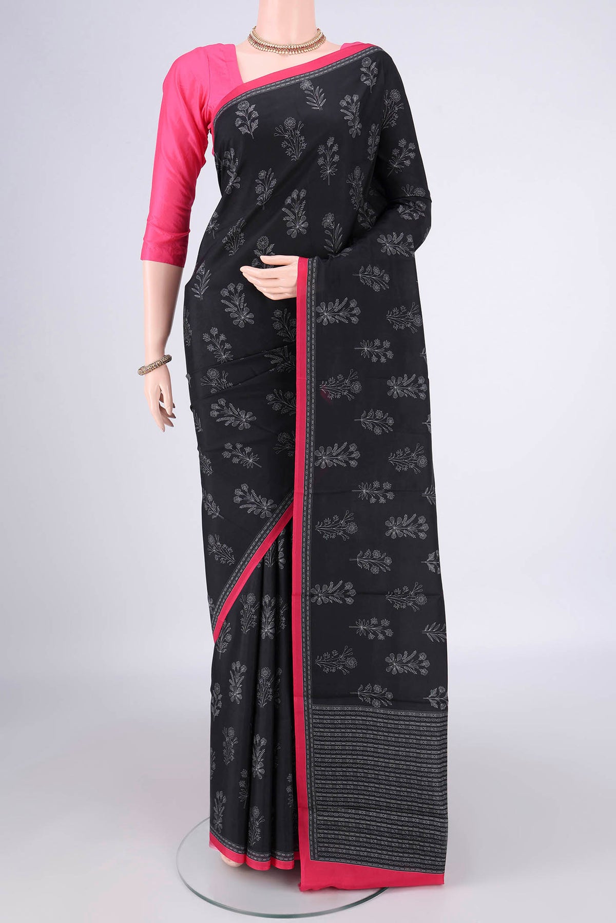 Pure Silk Black Dual Tone Printed Saree with Printed design on the body and Plain Border.  displayed on a mannequin