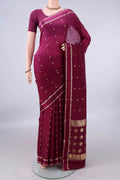 Magenta Mysore Crepe Saree with Zari Butta on the body and Zari Border.  displayed on a mannequin