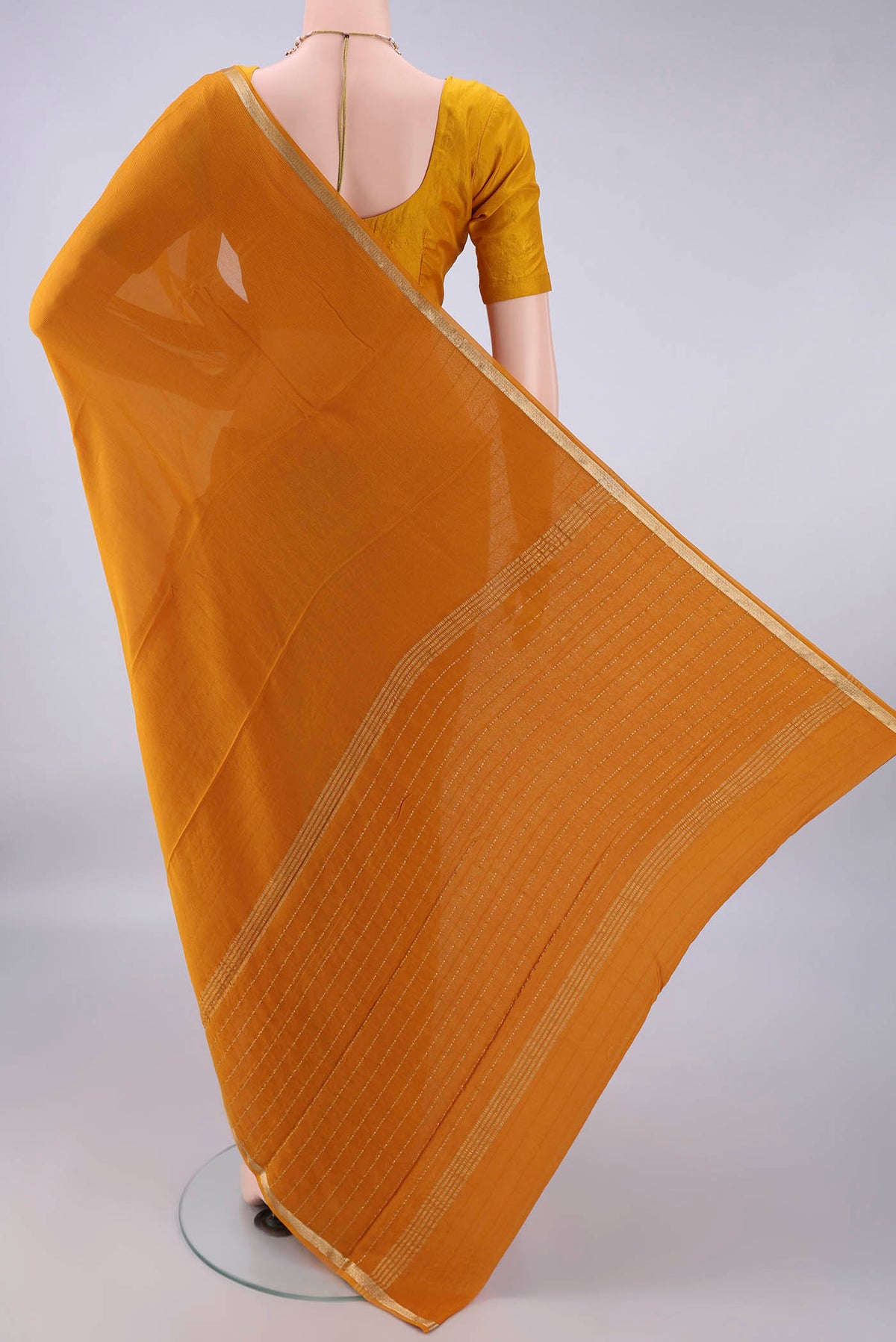 Flat view of Mustard Mysore Chiffon Saree with Plain Body and Zari Border. 
