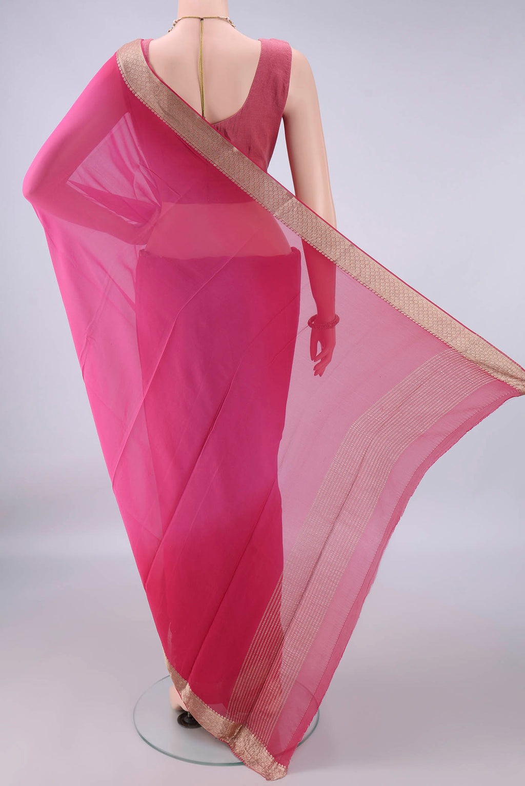 Flat view of Pink Mysore Georgette Saree with Plain Body and Zari Border. 