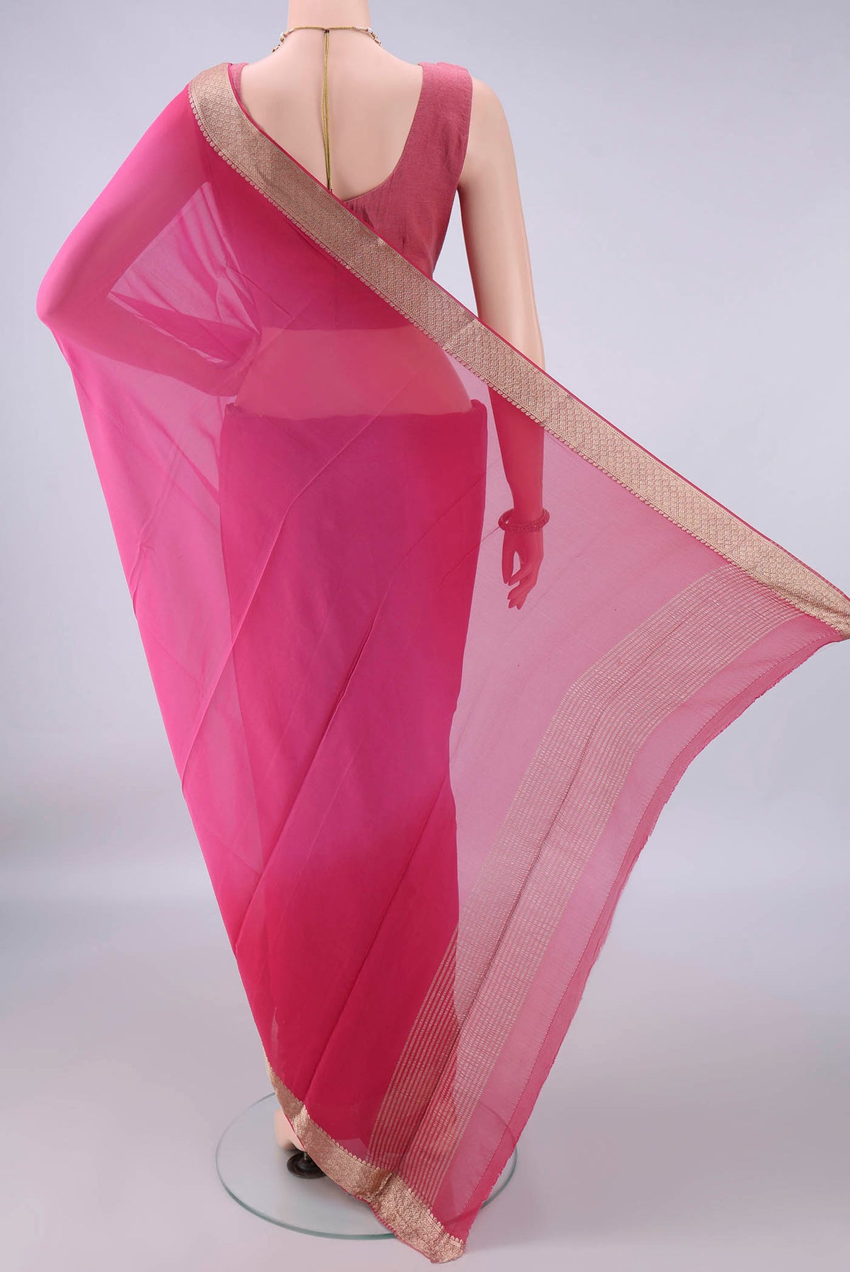 Flat view of Pink Mysore Georgette Saree with Plain Body and Zari Border. 