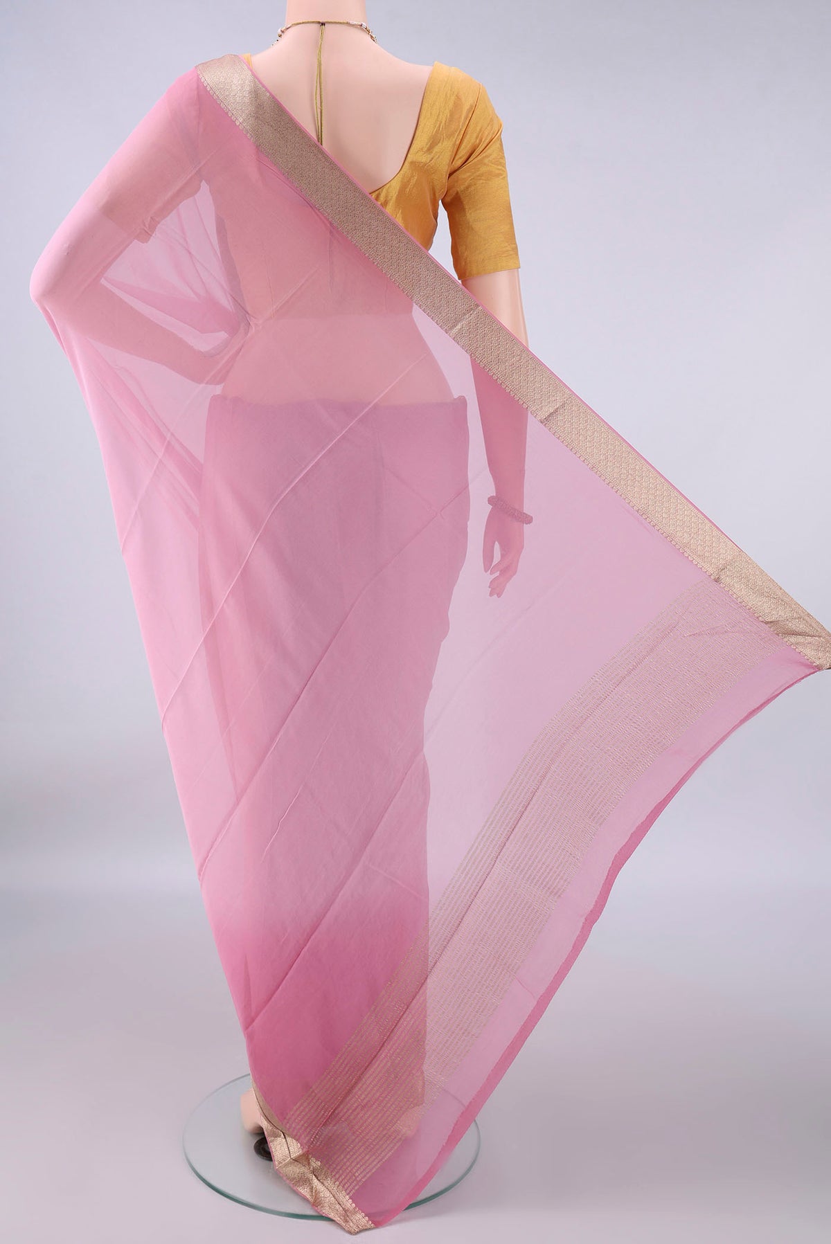 Flat view of Rose pink Mysore Georgette Saree with Plain Body and Zari Border. 