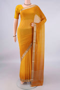Mustard Mysore Georgette Saree with Plain Body and Zari Border.  displayed on a mannequin