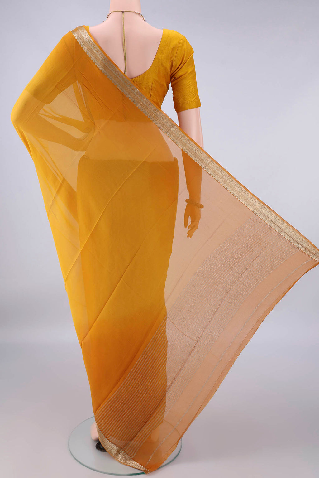 Flat view of Mustard Mysore Georgette Saree with Plain Body and Zari Border. 