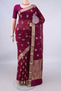 Magenta Mysore Georgette Saree with Zari Butta on the body and Zari Border.  displayed on a mannequin