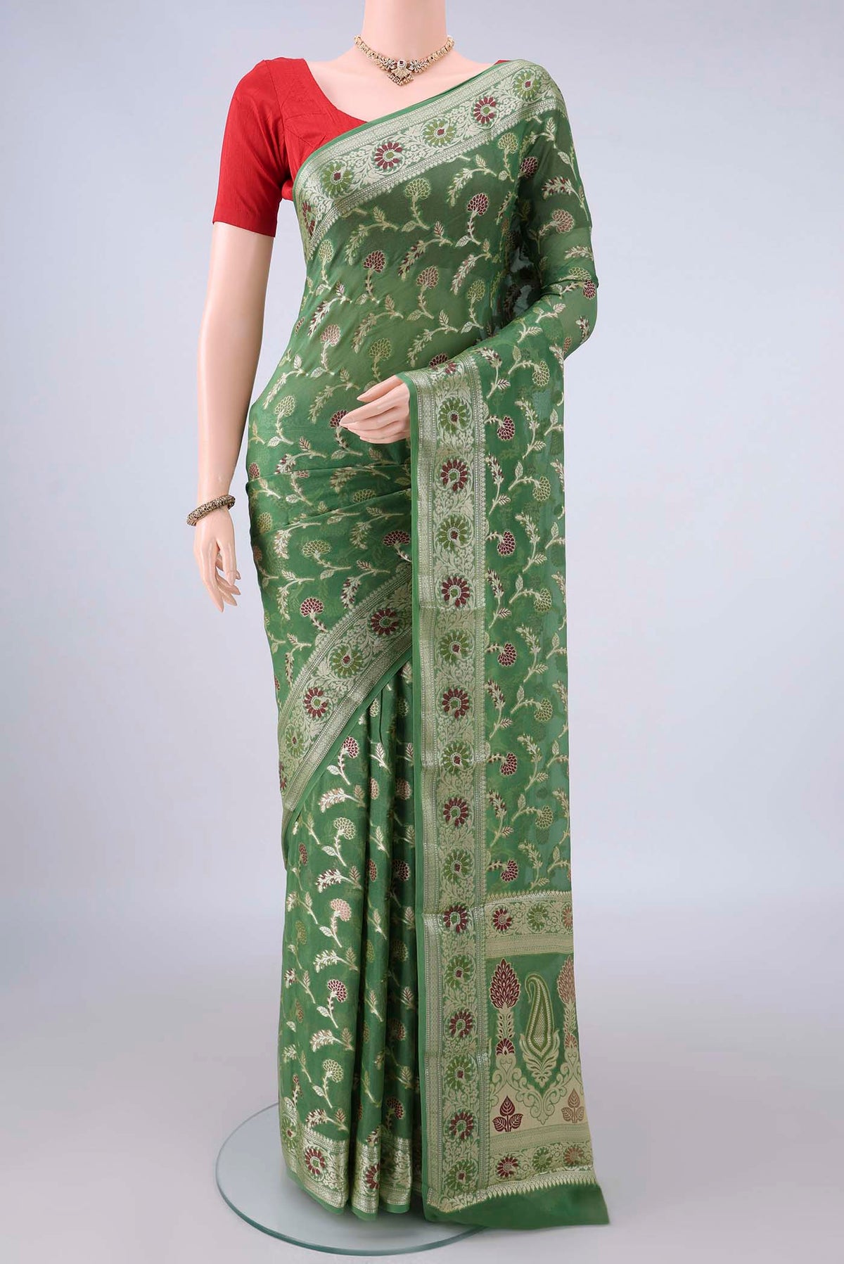 Green Blended Banarasi Georgette Saree with Thread Brocade on the body and Zari And Thread Border.  displayed on a mannequin