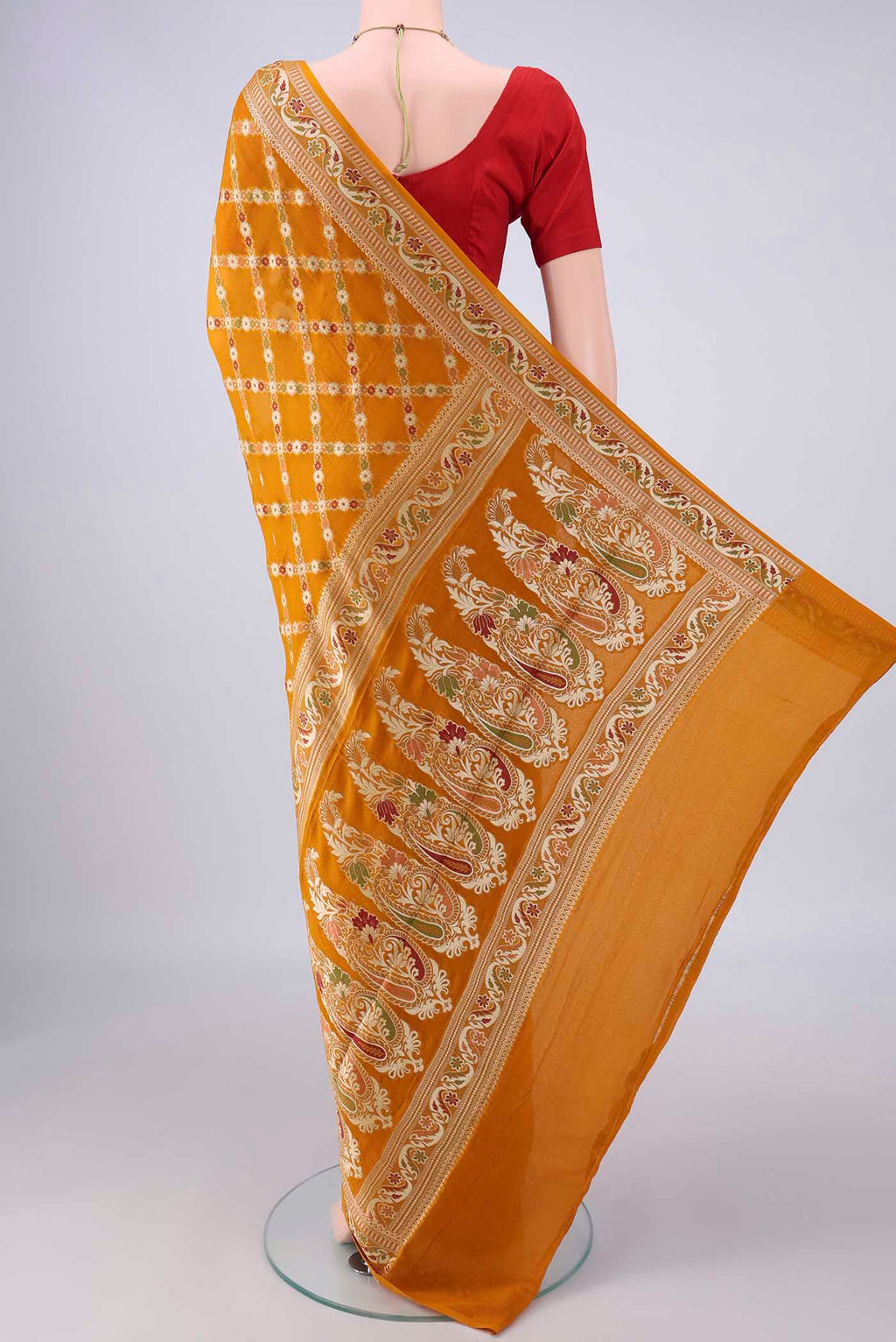 Flat view of Mustard Blended Banarasi Georgette Saree with Thread Brocade on the body and Zari And Thread Border. 