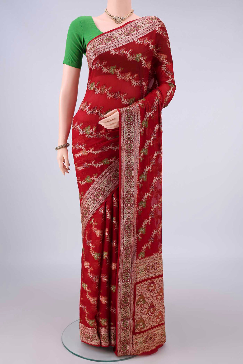 Red Blended Banarasi Georgette Saree with Thread Brocade on the body and Zari And Thread Border.  displayed on a mannequin