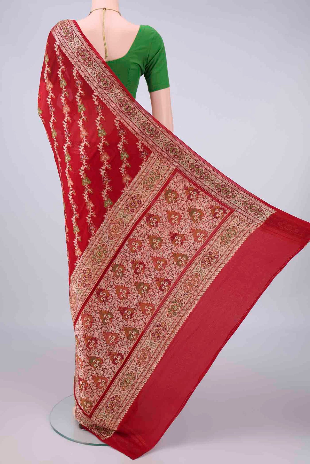 Flat view of Red Blended Banarasi Georgette Saree with Thread Brocade on the body and Zari And Thread Border. 