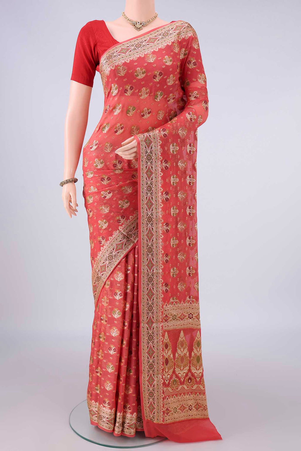 Peach Blended Banarasi Georgette Saree with Thread Brocade on the body and Zari And Thread Border.  displayed on a mannequin