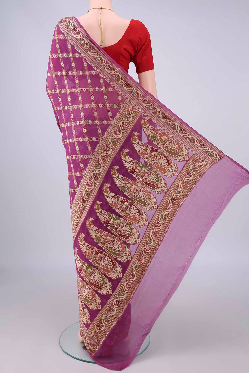 Flat view of Light Magenta Blended Banarasi Georgette Saree with Thread Brocade on the body and Zari And Thread Border. 