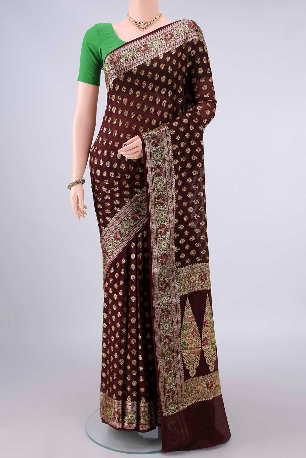 Brown Blended Banarasi Georgette Saree with Thread Butta on the body and Zari And Thread Border.  displayed on a mannequin