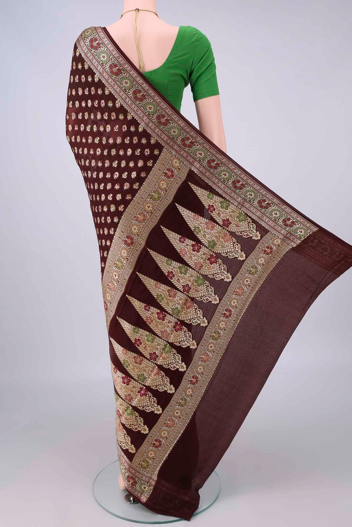 Flat view of Brown Blended Banarasi Georgette Saree with Thread Butta on the body and Zari And Thread Border. 