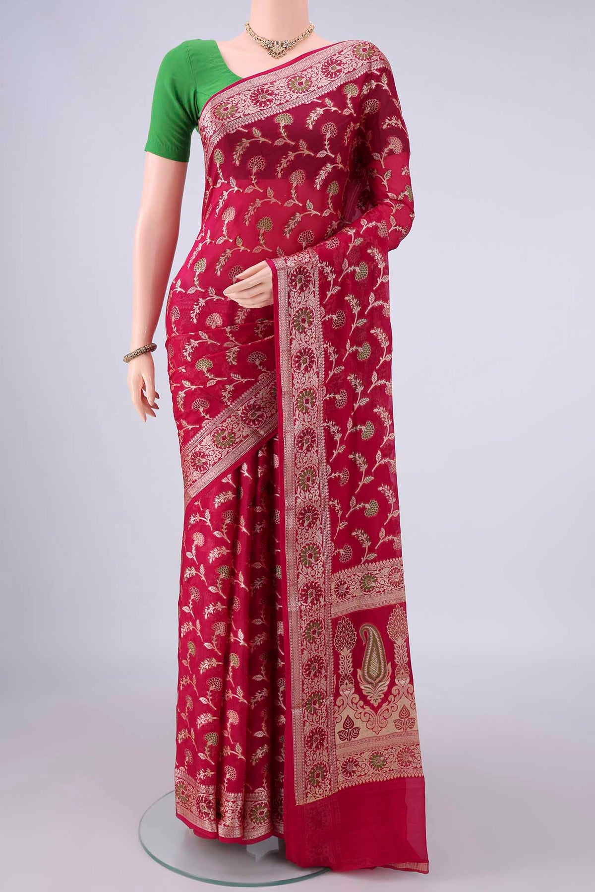 Dark Pink Blended Banarasi Georgette Saree with Thread Brocade on the body and Zari And Thread Border.  displayed on a mannequin