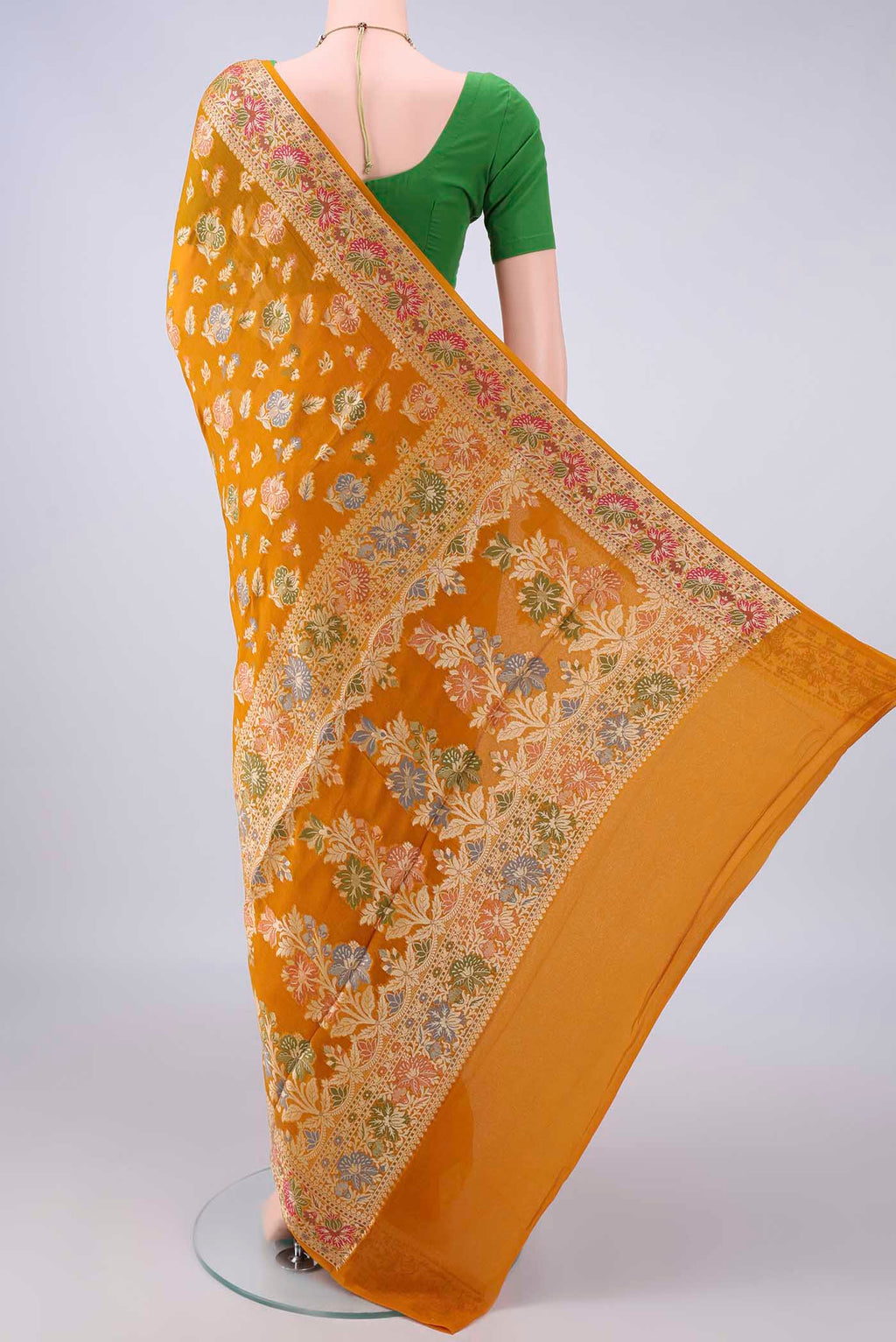 Flat view of Mustard Blended Banarasi Georgette Saree with Thread Butta on the body and Zari And Thread Border. 