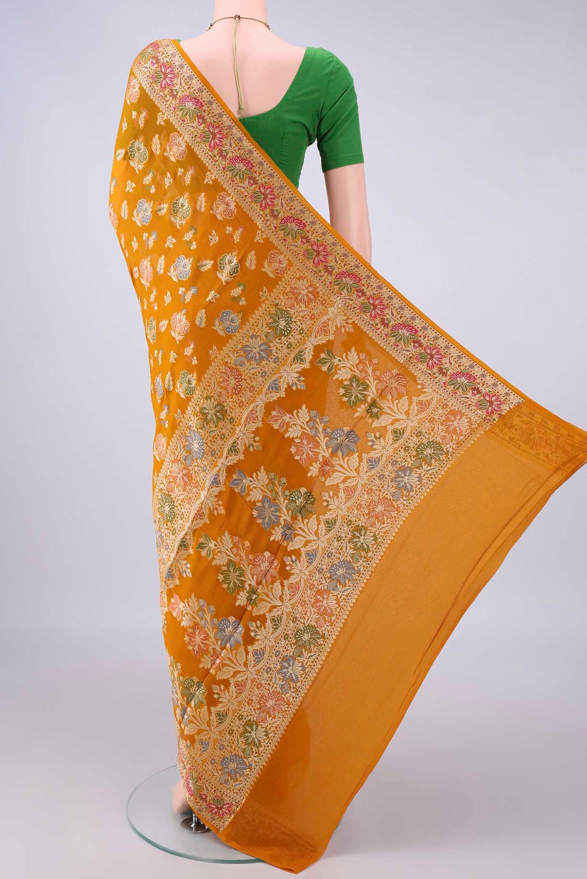 Flat view of Mustard Blended Banarasi Georgette Saree with Thread Butta on the body and Zari And Thread Border. 