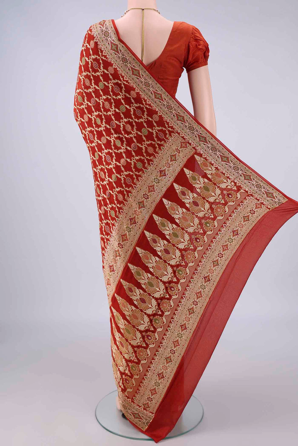 Flat view of Rust Blended Banarasi Georgette Saree with Thread Brocade on the body and Zari And Thread Border. 