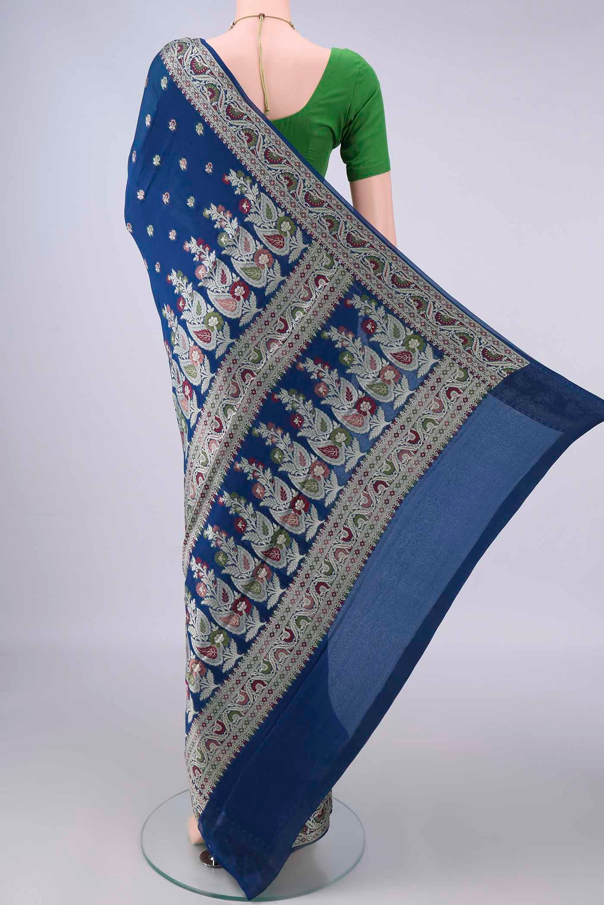 Flat view of Blue Blended Banarasi Georgette Saree with Thread Butta on the body and Zari And Thread Border. 