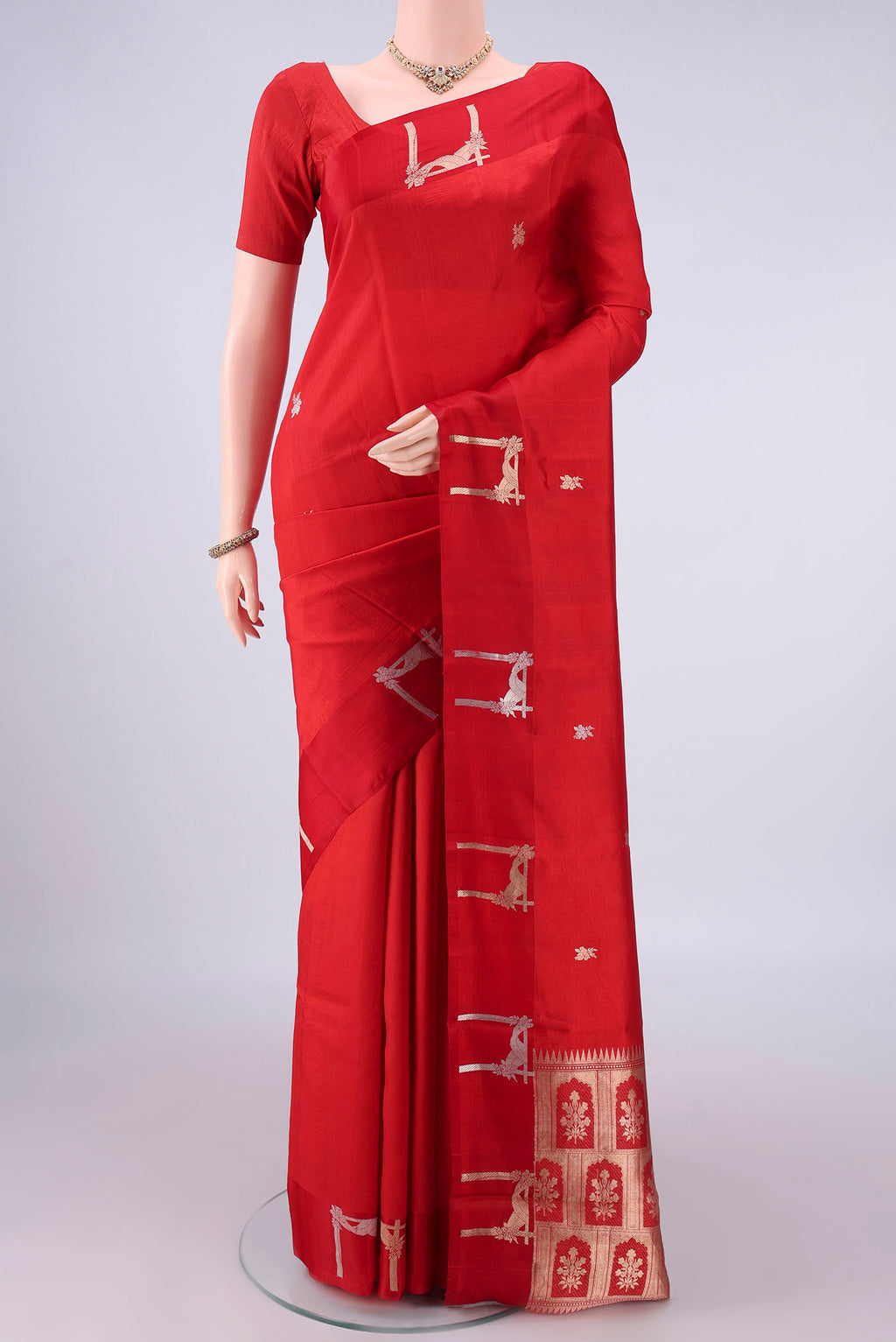 Pure Silk Red Banarasi Katan Saree with Zari Butta on the body and Satin Border.  displayed on a mannequin