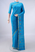 Pure Silk Blue Kanchipuram Saree with Plain Body and Zari Border.  displayed on a mannequin