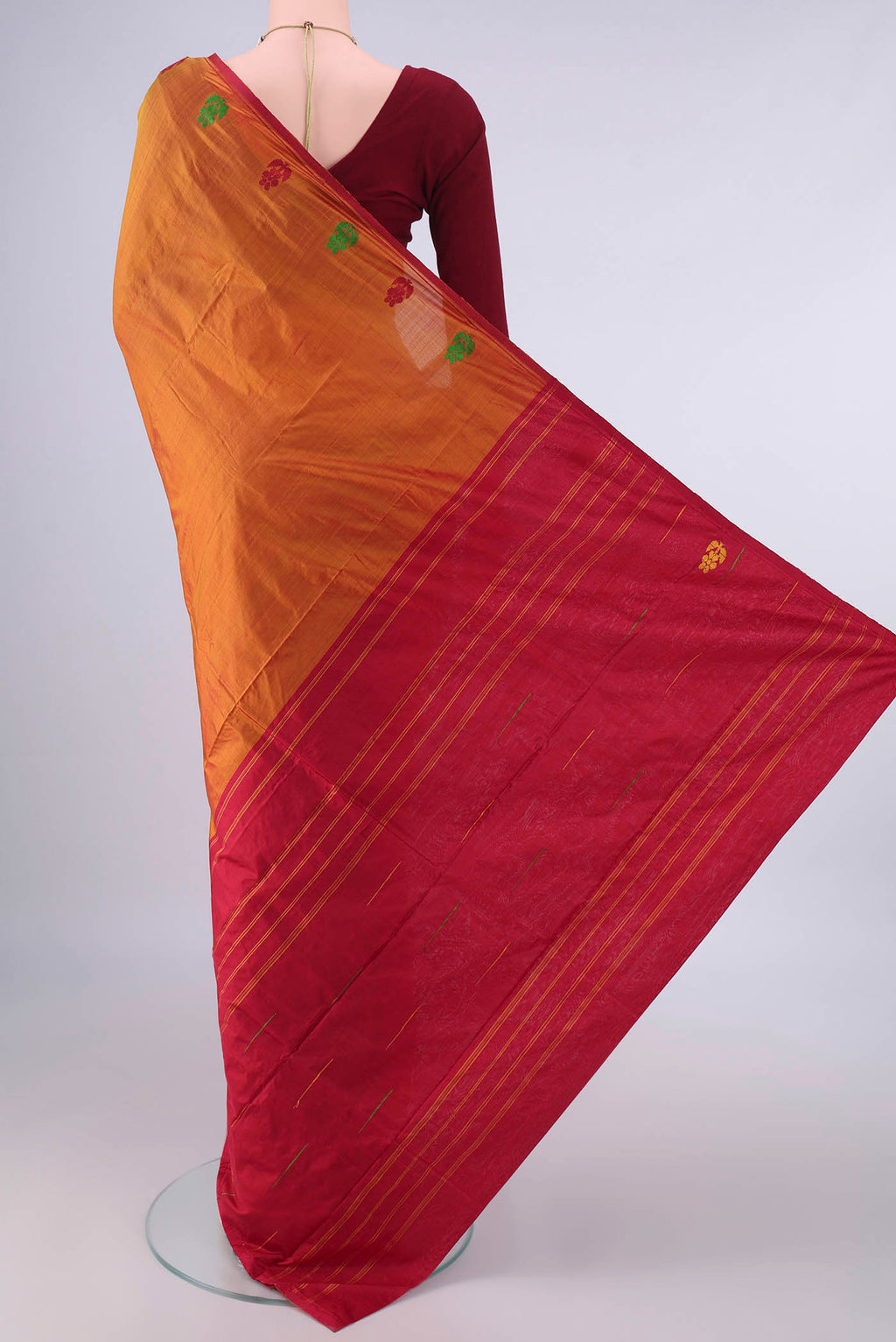 Flat view of Pure Silk Rust Kanchipuram Saree with Plain Body and Zari And Thread Border. 